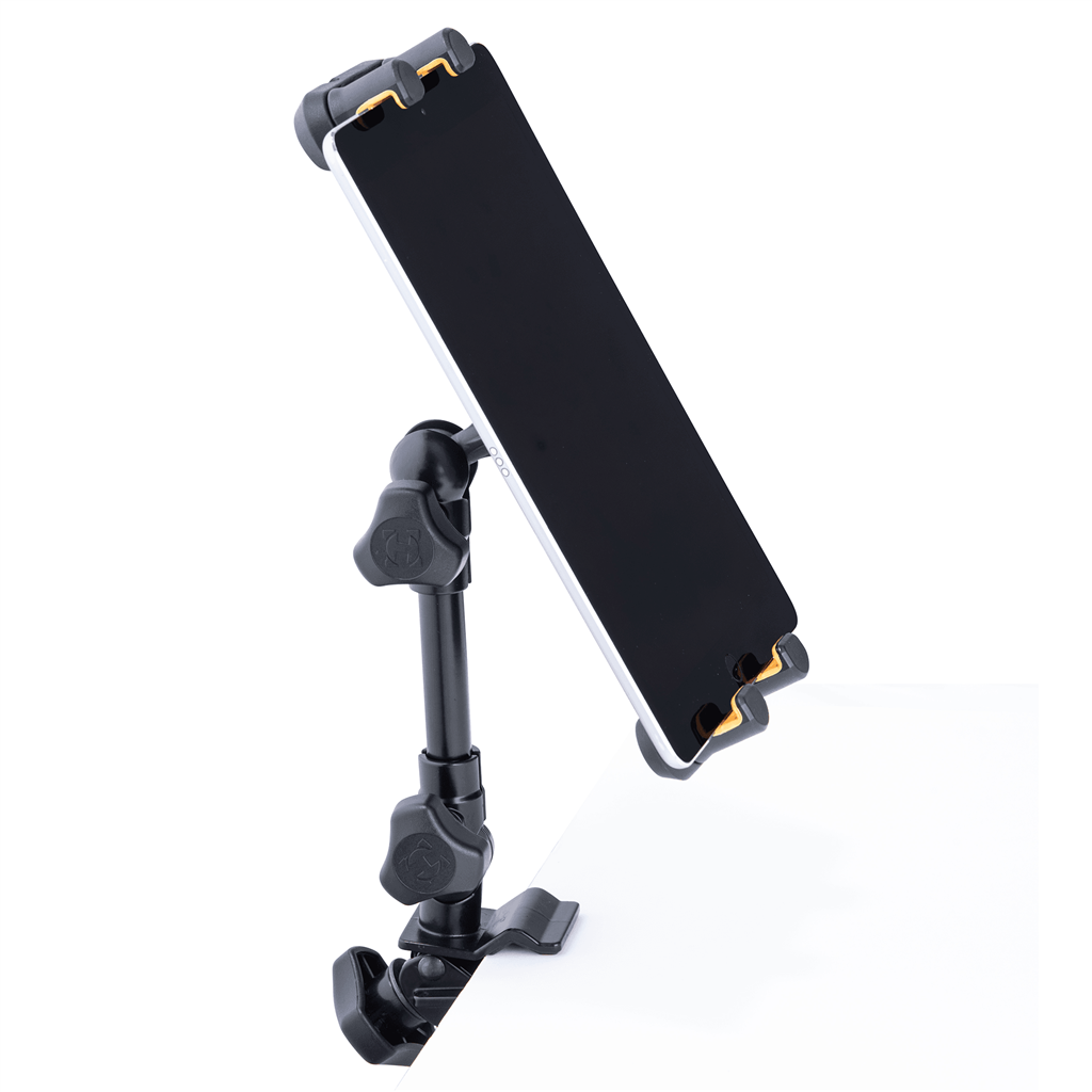 Smartphone mounted on a black adjustable desk stand with clamps, angled over a white desk surface